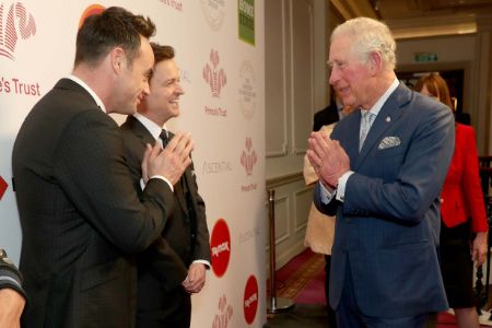 prince charles greeting people with a namastey 
